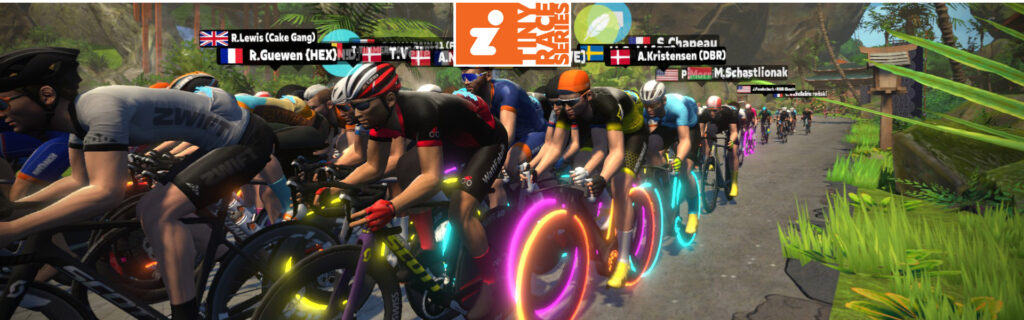 A large group of cyclists in colorful gear race on a virtual road, many with glowing neon wheels, in a lush, tropical digital environment from the Zwift online cycling platform.