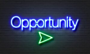 opportunity-neon-sign-brick-wall-background-87058452
