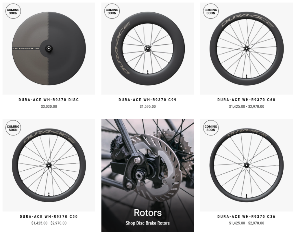 Grid of six Shimano Dura-Ace bicycle wheels with prices, five labeled COMING SOON. Center image shows a close-up of a bike disc brake rotor above text: Rotors, Shop Disc Brake Rotors..