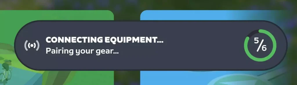 A screen displays CONNECTING EQUIPMENT... Pairing your gear... with a progress circle showing 5 out of 6 completed steps. Green and blue areas are visible in the background.