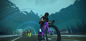 A cyclist on a purple Trek bike leads a pack of riders through an underwater tunnel.