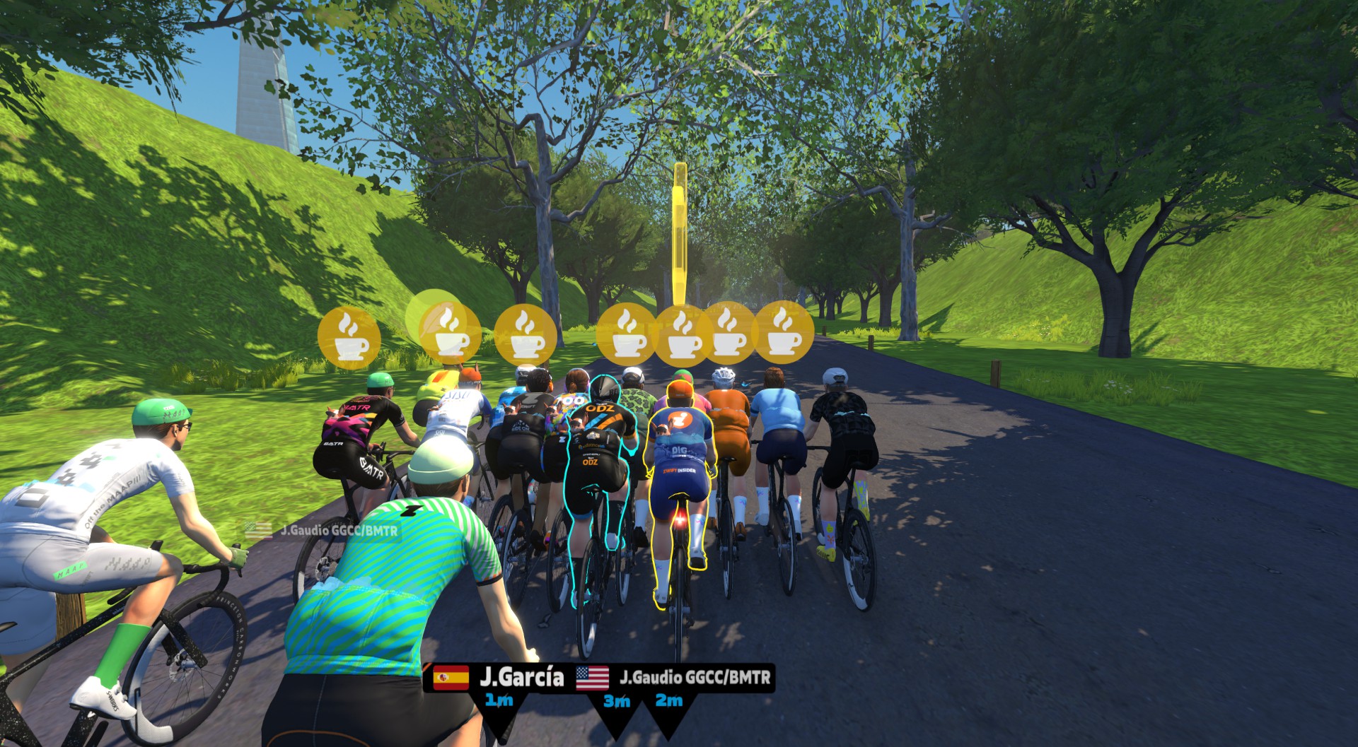A group of cyclists riding together on a virtual road, with floating coffee cup icons and player name tags visible above them.
