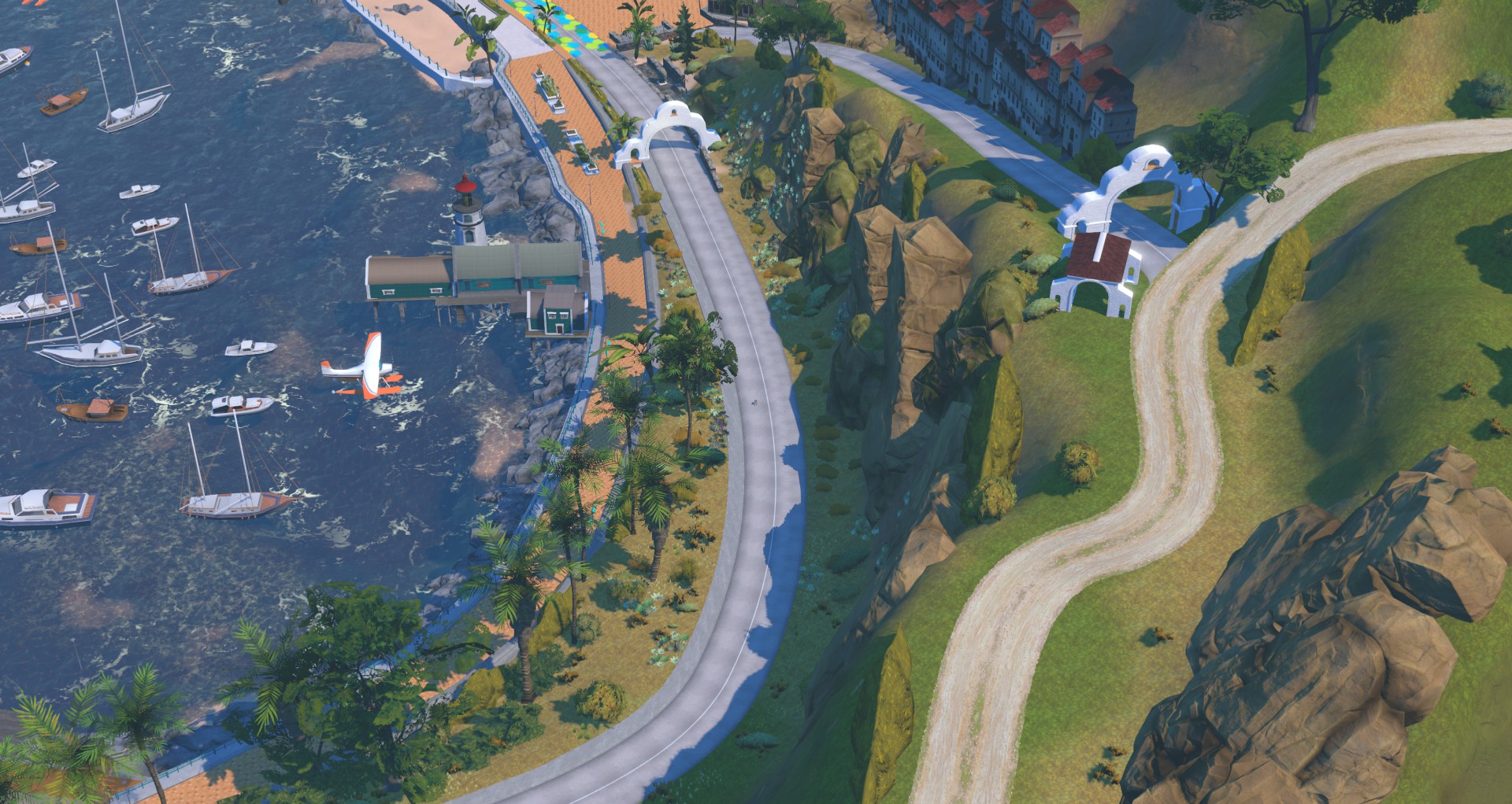 An aerial view of a coastal town featuring a marina with several sailboats, a lighthouse on a pier, a small seaplane, and a winding road that travels along the rocky coastline.