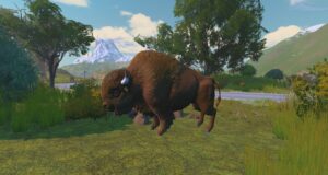 A bison standing in a grassy meadow with mountains in the distance.