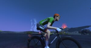 A cyclist in a green and black Zwift jersey rides a black Buffalo bicycle in a volcanic landscape.