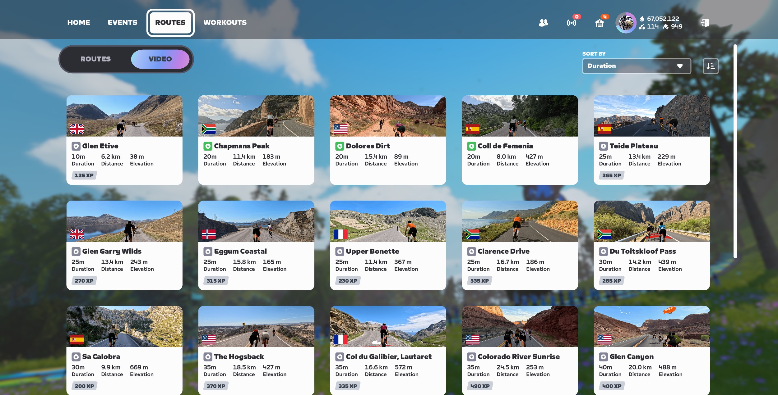 A digital interface displaying a grid of cycling routes, each featuring a preview image, country flag, name, duration, distance, elevation gain, and experience point value.