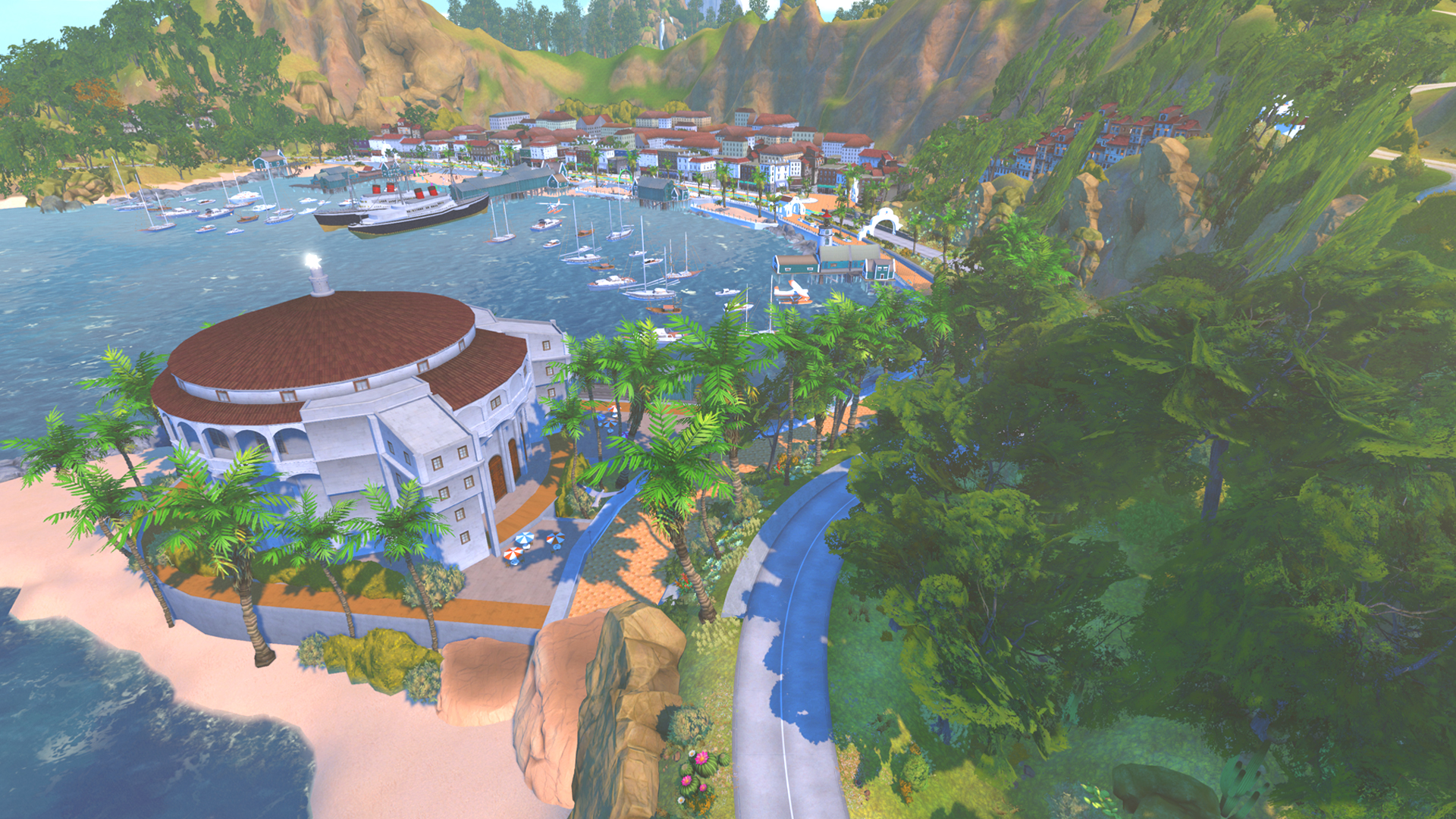 An aerial view of a coastal town with a large domed building on the beach, a harbor filled with boats, and mountains in the background.